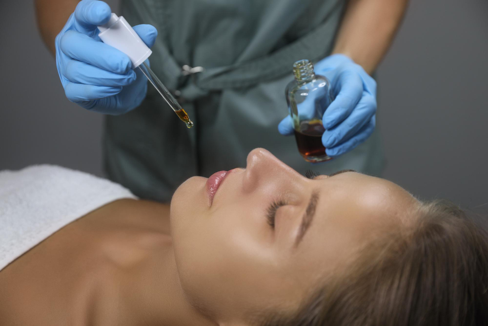 Close-up of a peptide therapy treatment setting with a dropper and clinical skincare application, representing personalized peptide therapy at Divine Naturopathic Clinic in Kirkland, WA.