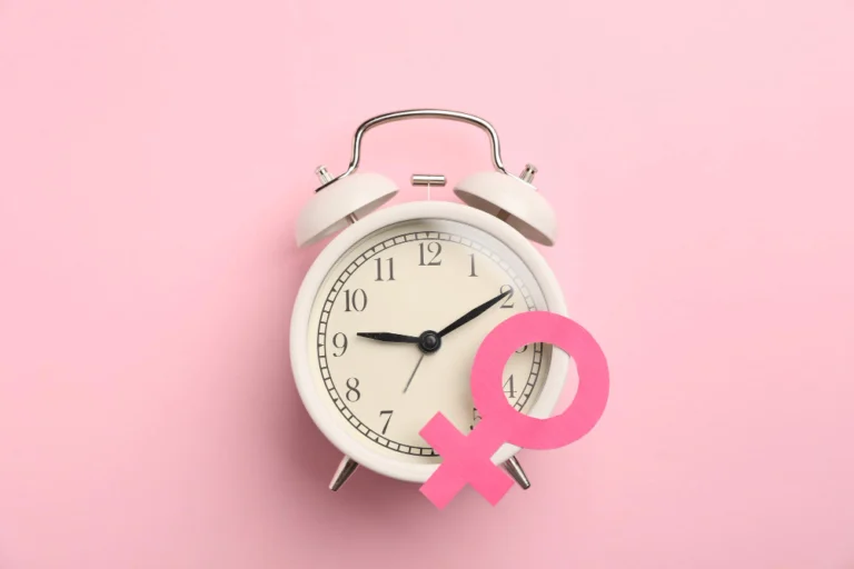 Alarm clock with female symbol representing perimenopause hormone changes
